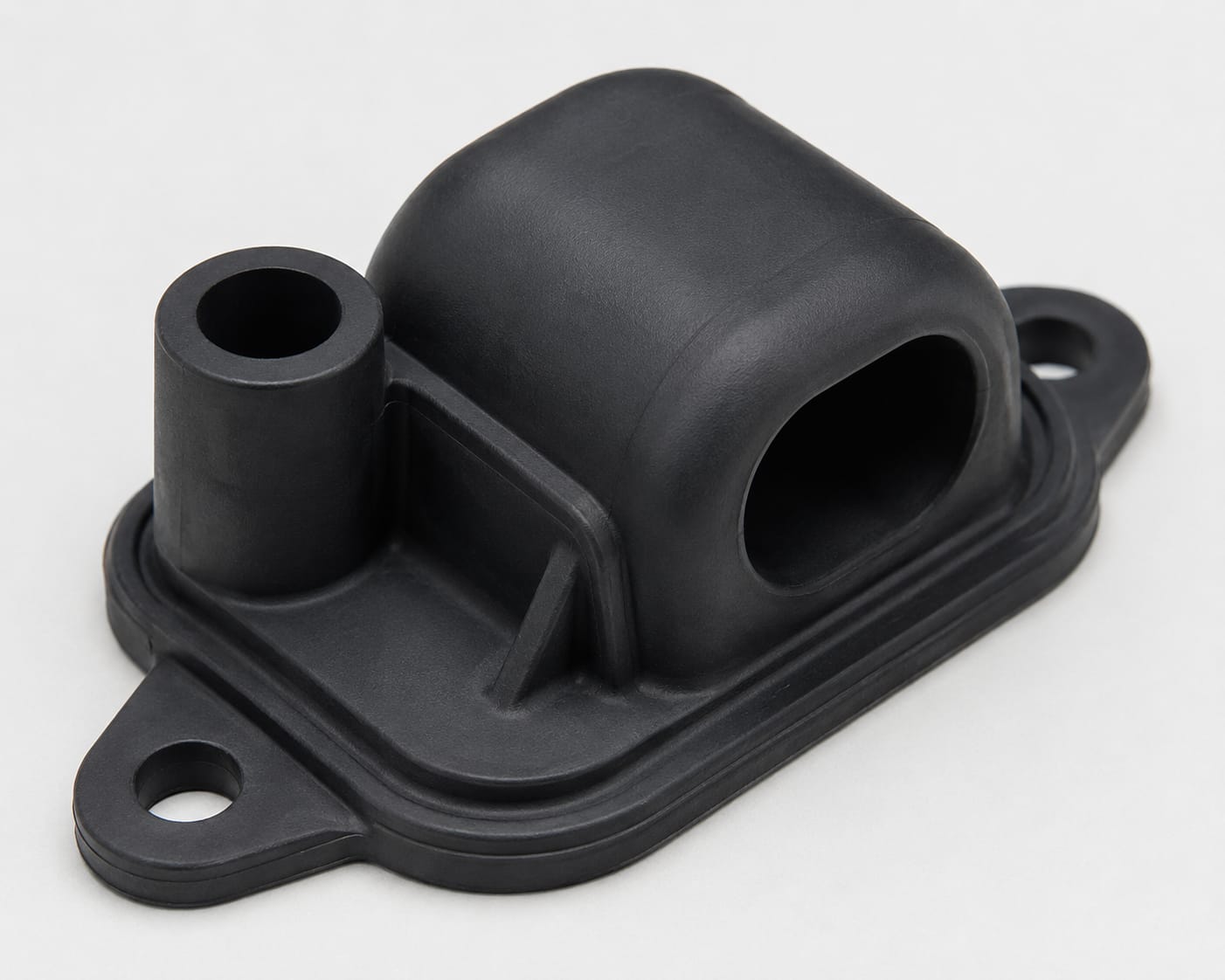 Moulded rubber housing component